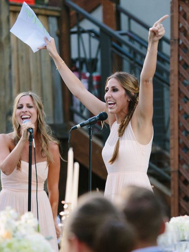 Maid of honor singing at wedding